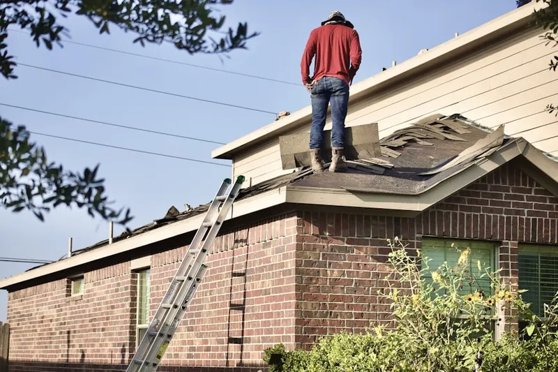 Professional roofer working on a residential roof in Sunrise Estates